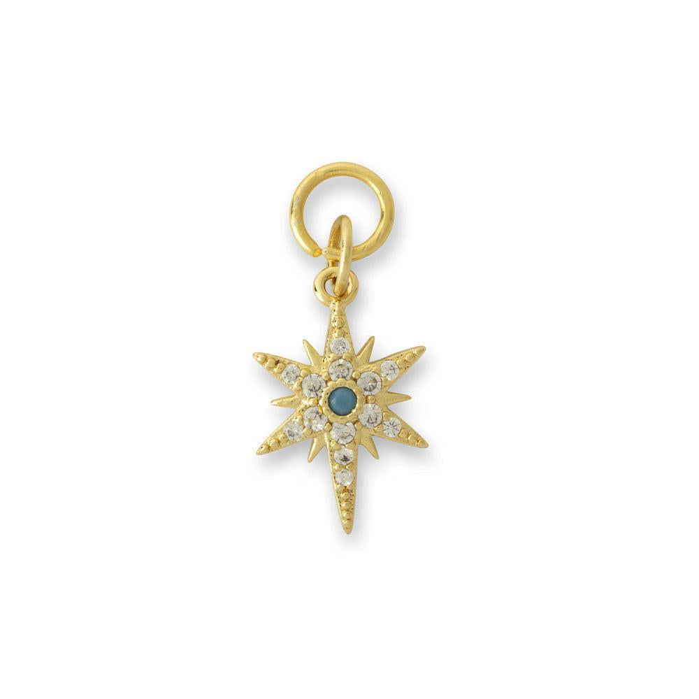Gold-coloured star-shaped charm with a turquoise stone in the centre surrounded by faux diamonds.