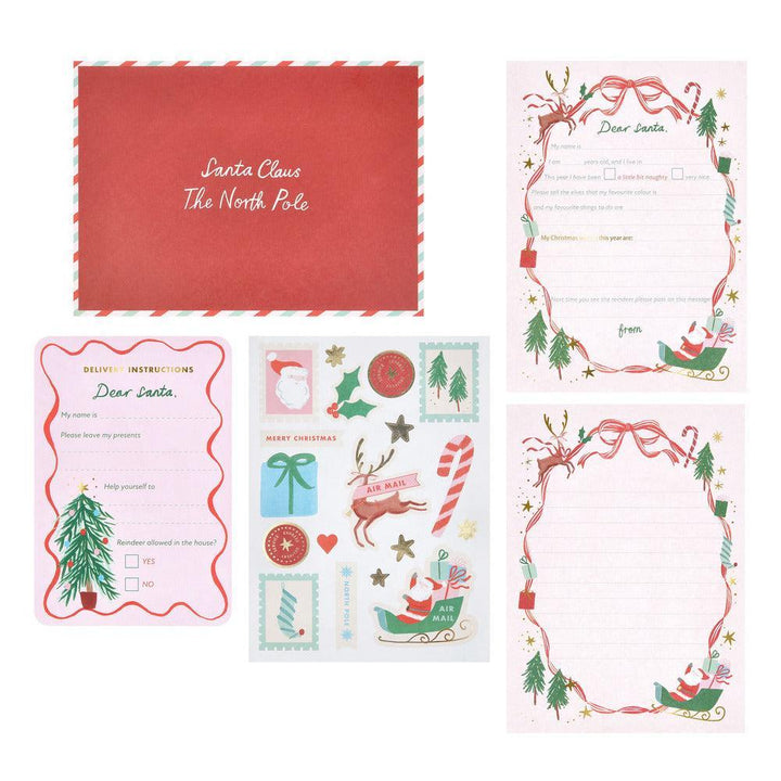 Collection of Christmas-themed stationery items including envelopes and cards with Santa Claus