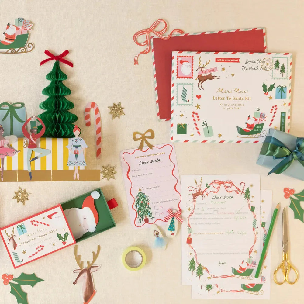 Christmas-themed stationery set with envelopes, cards, and decorative items