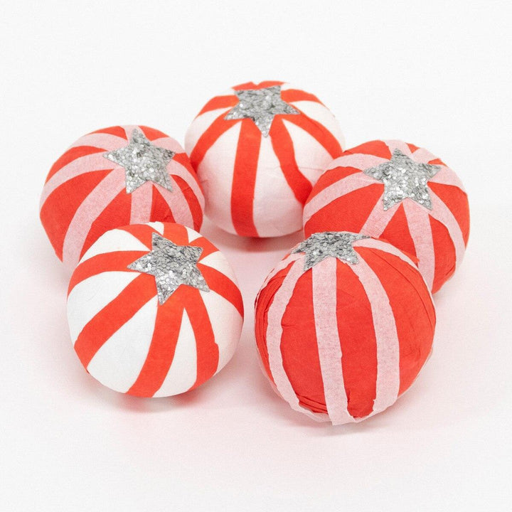 Red and white peppermint candy striped surprise balls with silver star decorations