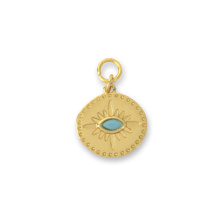A gold-colored coin-shaped charm with a northern star design and a turquoise stone in the center.