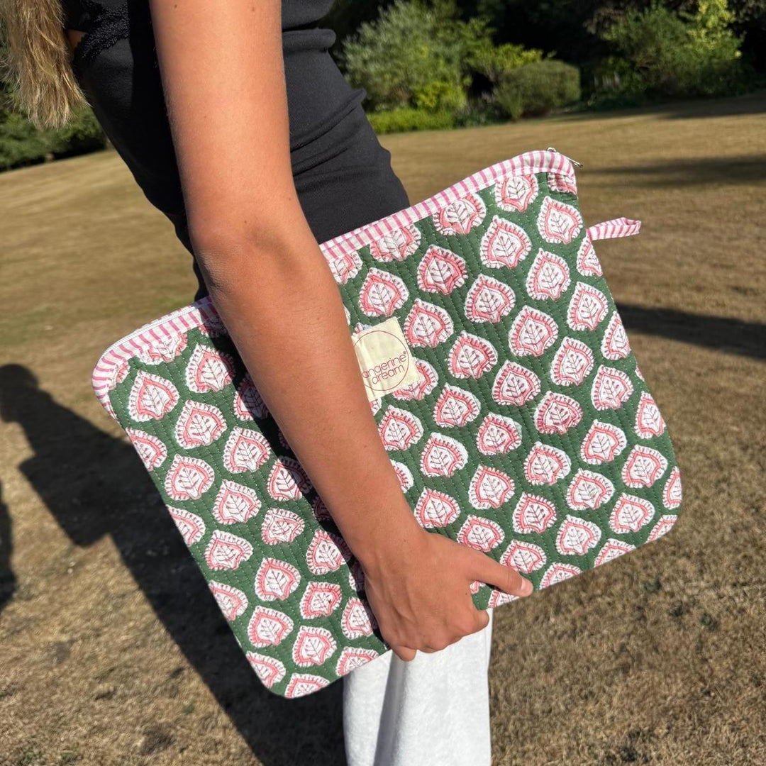 green and pink patterned laptop case