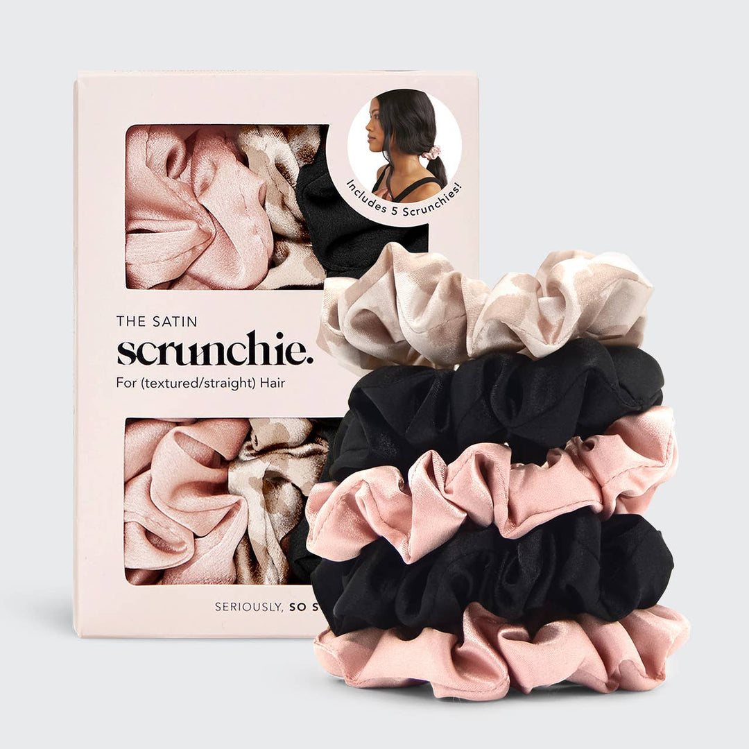 Set of satin scrunchies in pink, black, and beige with packaging on a light gray background