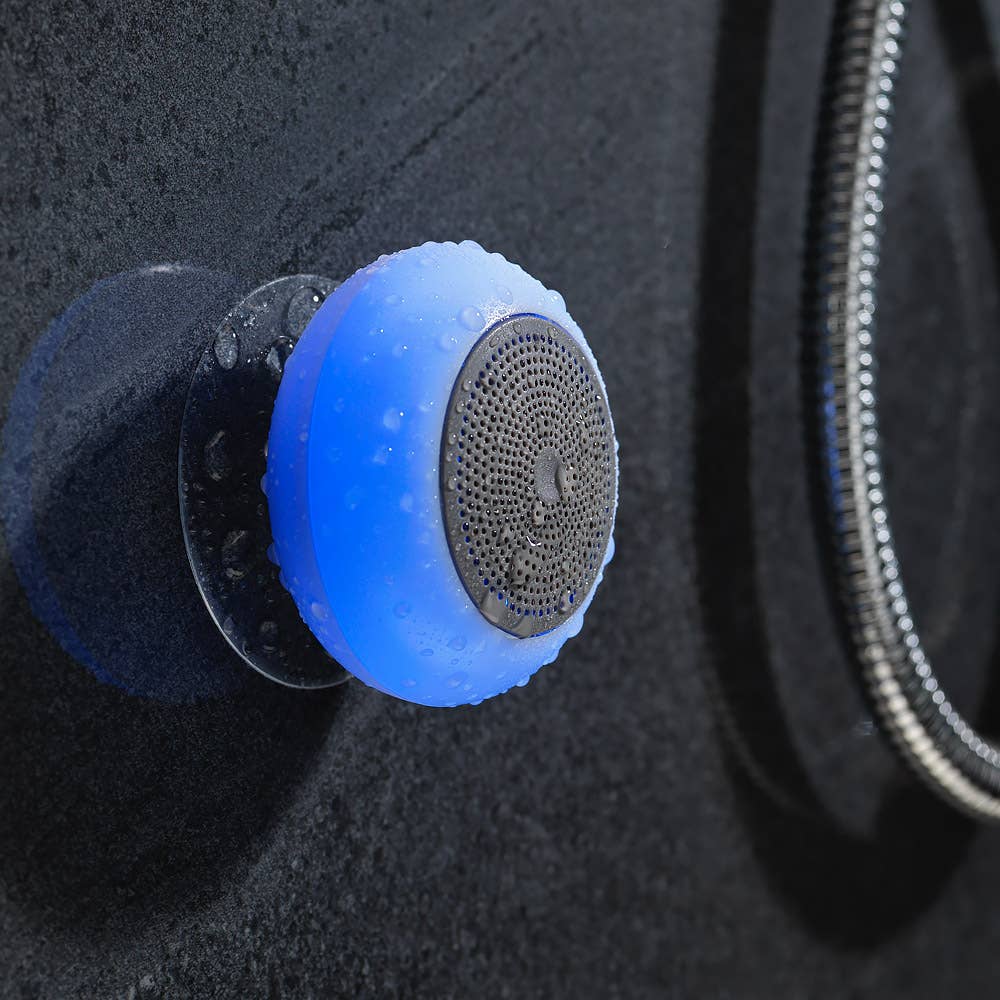 Blue shower head with black nozzle on a dark textured surface