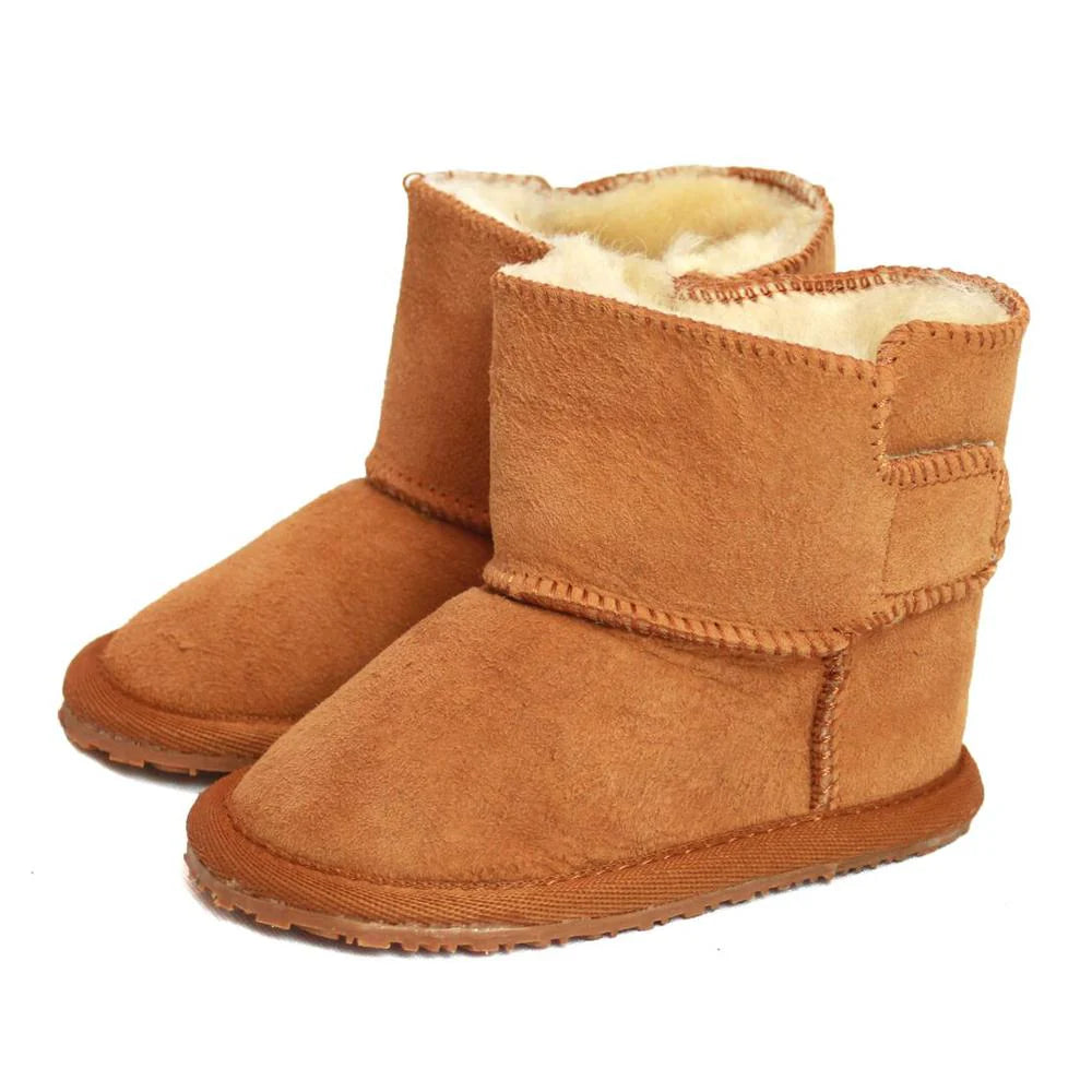 A pair of tan-coloured sheepskin baby boots.