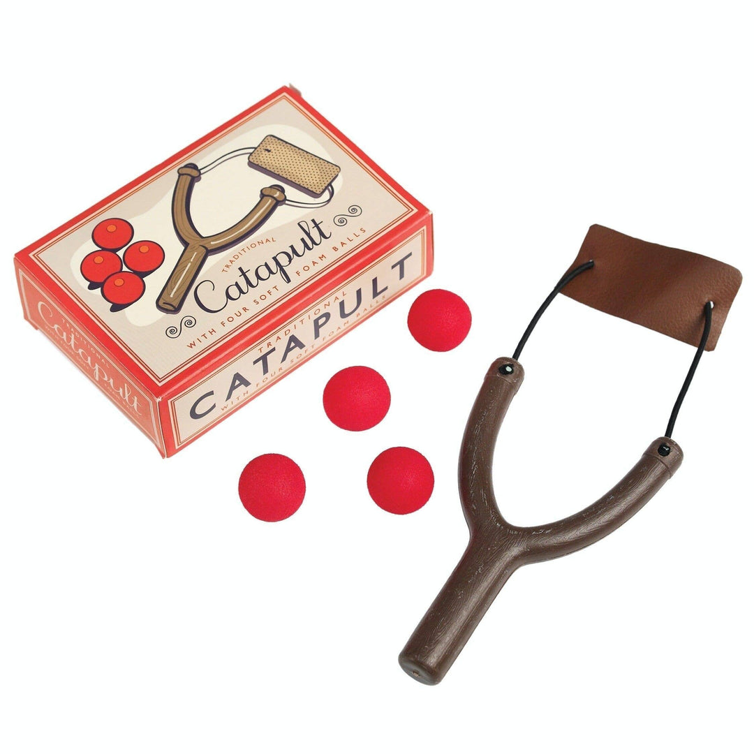 Catapult set with red balls and packaging on a white background