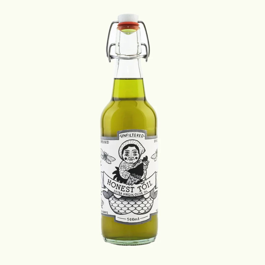 Bottle of Honest Toil olive oil on a white background